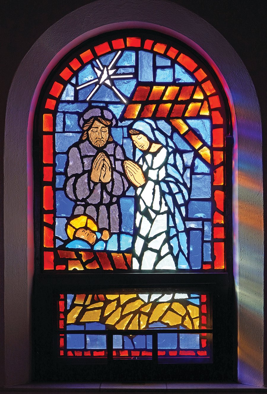 Stained glass depicting the Holy Family, in St. Joseph Church in Pilot Grove.